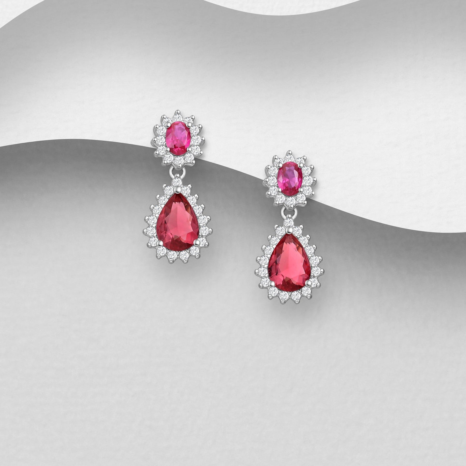 Ruusunpunaiset Sterling Hopea 925 -korvakorut kaksiosaisella pisarakristallilla.
