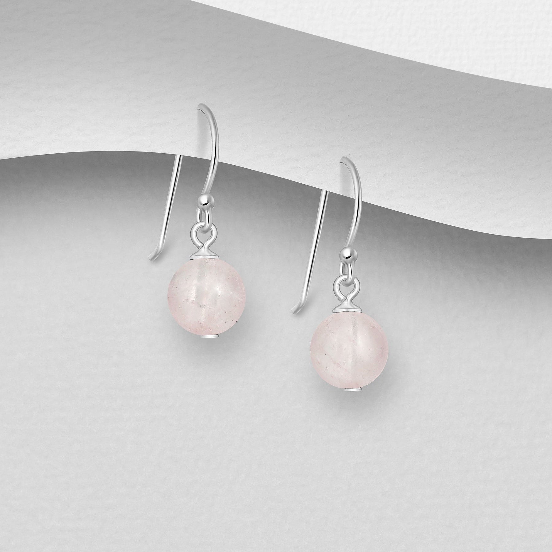 Vaaleanpunaiset pyöeät ruusukvartsikorvakorut aitoa hopeaa.