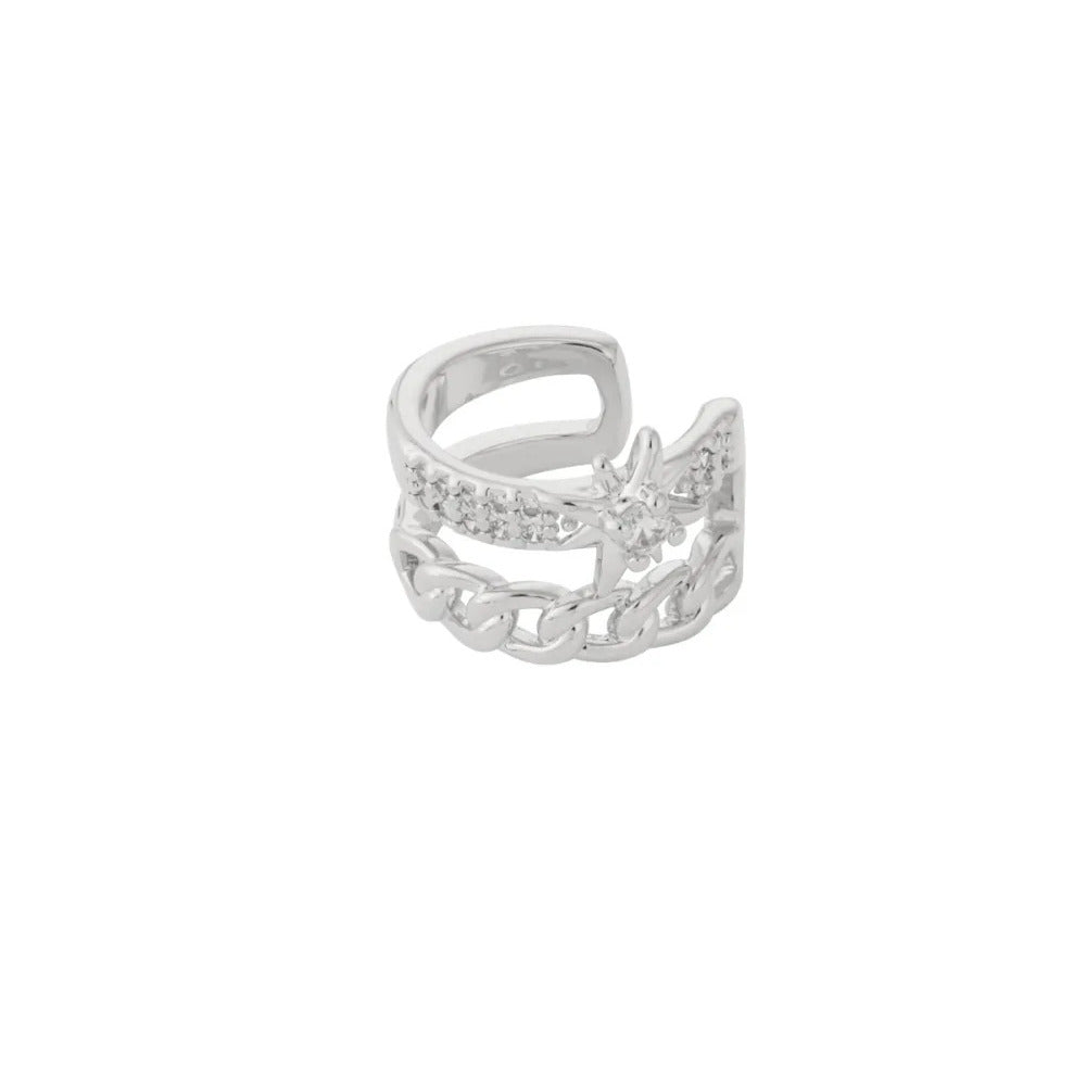 FRENCH RIVIERA Stellar Chain hopeanvärinen ear cuff -korvakoru, jossa ketjukuvio, kristallirivi ja tähtiyksityiskohta.