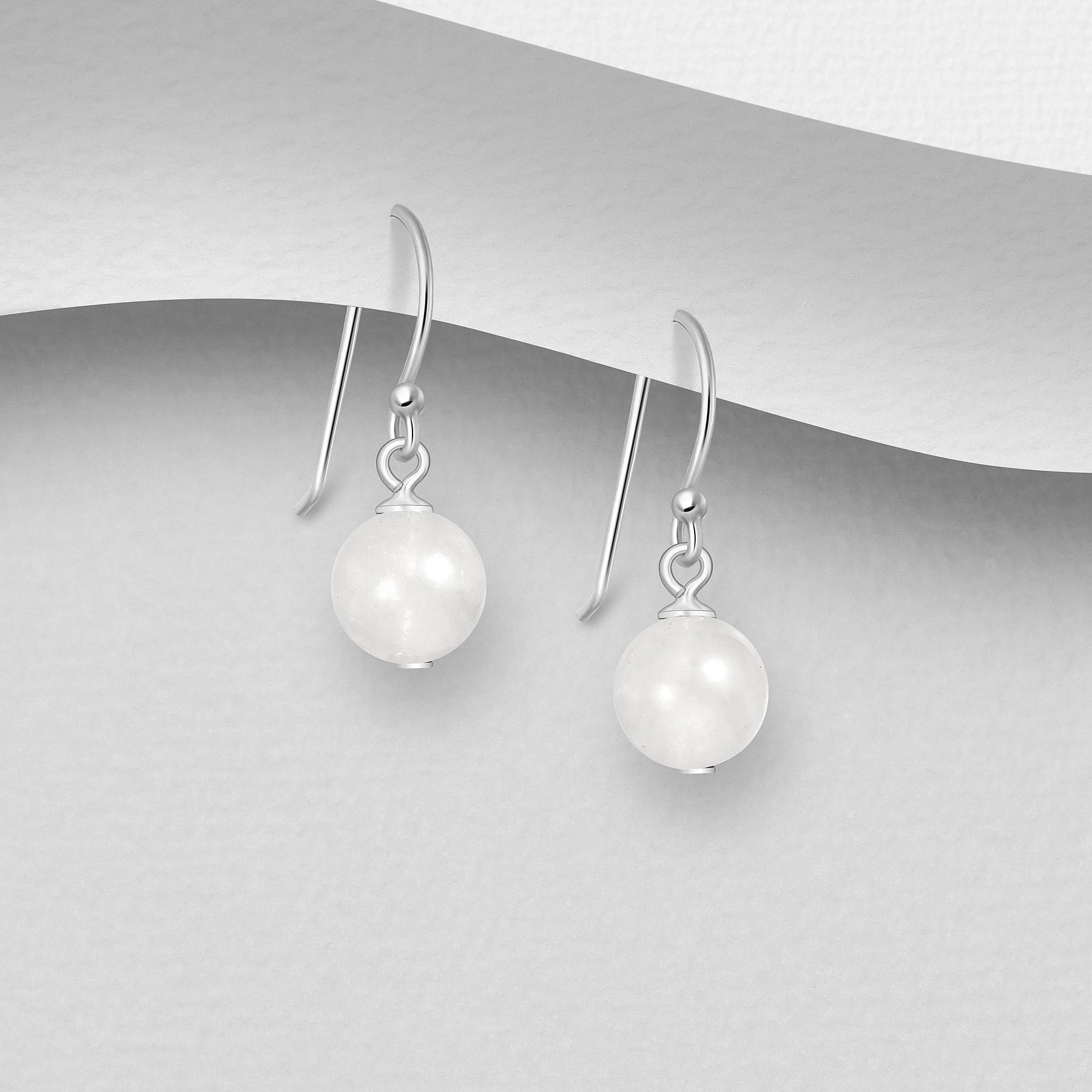 Yksinkertaiset kuukivikorvakorut aitoa hopeaa.