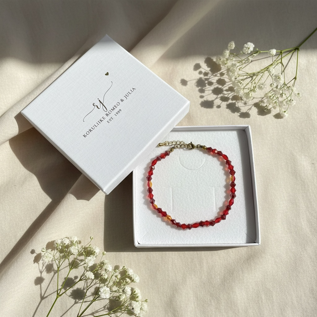 Punainen helmirannekoru 316L kirurginteräksestä, käsintehty Oulussa.