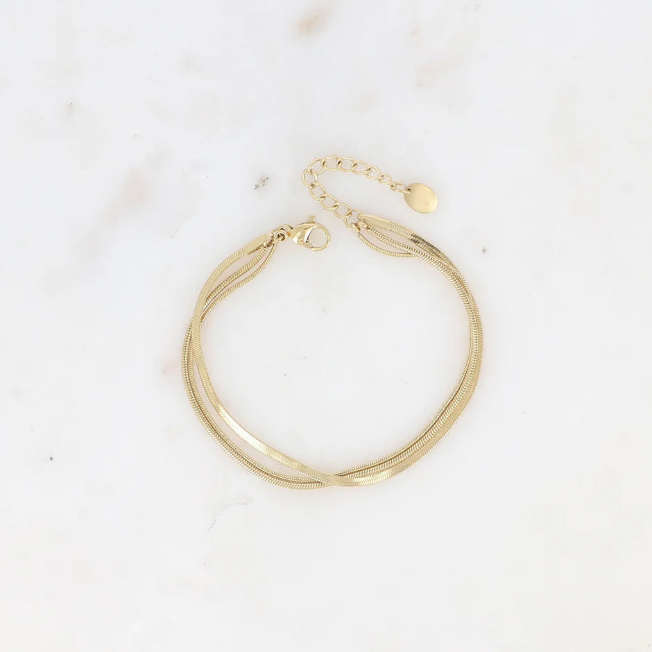BOHM PARIS Amal rannekoru snake chain ja peiliketju vaalealla pohjalls.