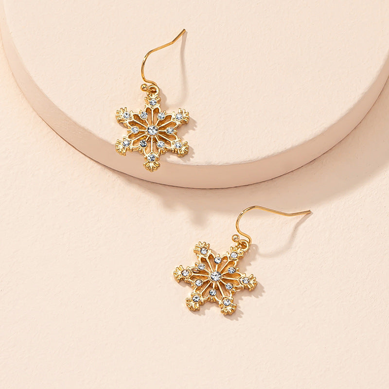 Snowlight – kultaiset lumihiutalekorvakorut