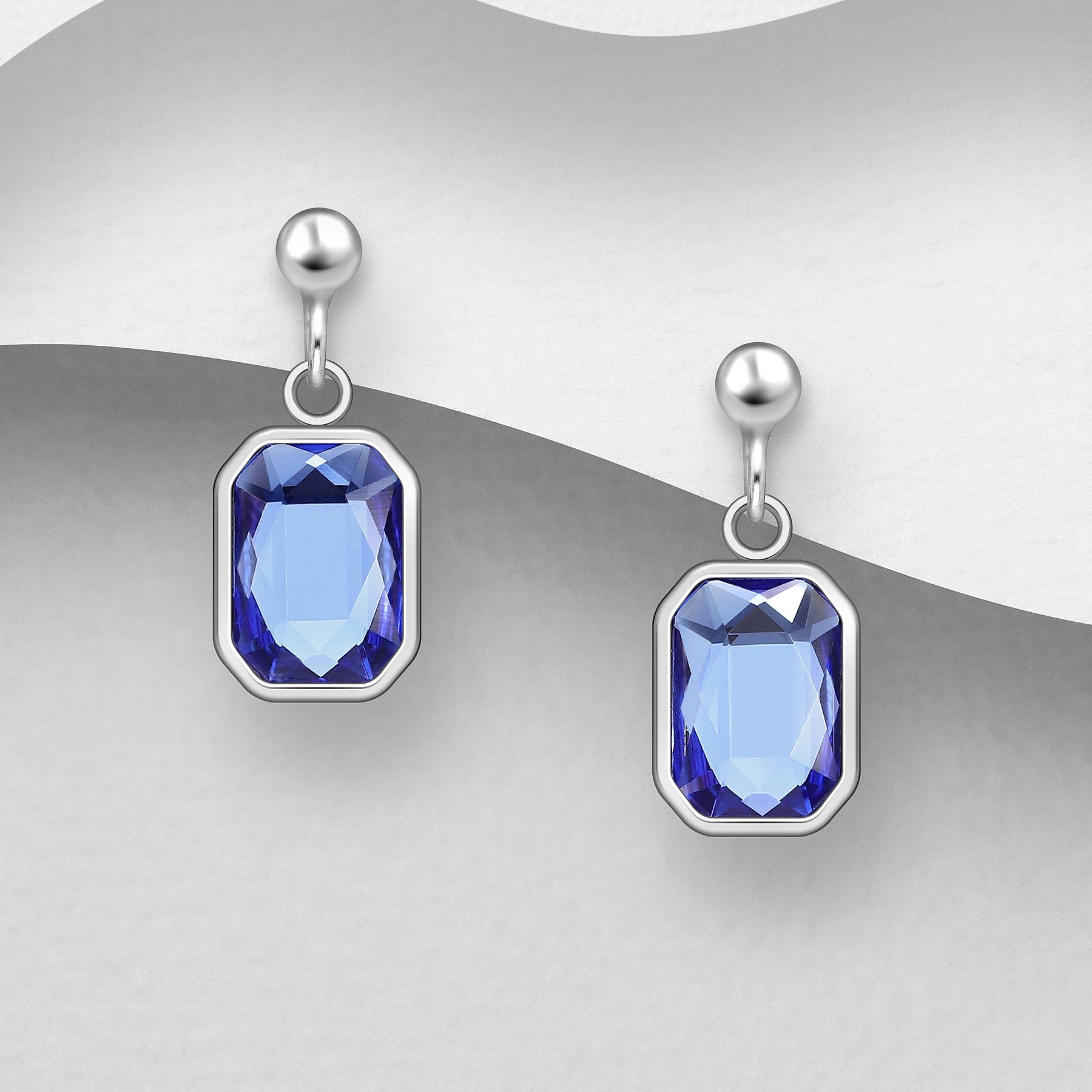 Sirot tappikorvakorut tummansinisellä kristallilla ja rhodium-pinnoitteella.